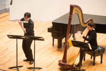 A Harpist and flute student at Manhattan School of Music perform in Greenfield Hall