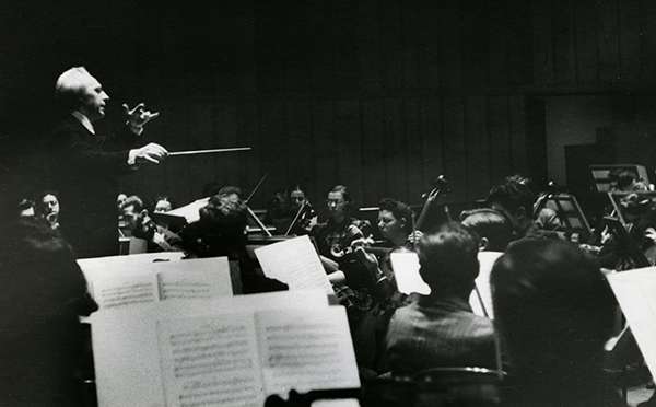 man conducting orchestra