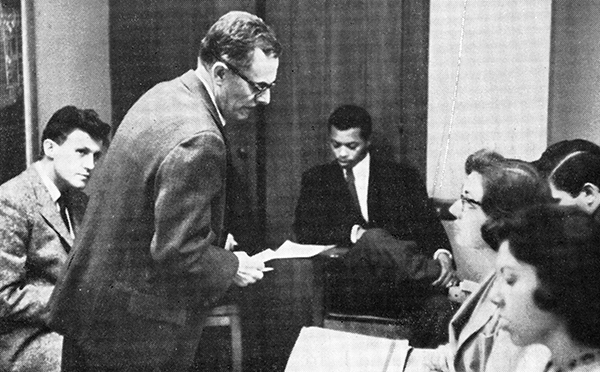 man teaching students in classroom