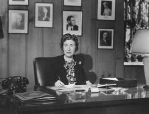 old photo of woman at desk