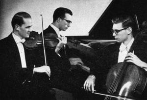 man playing violin, man at piano, man playing cello