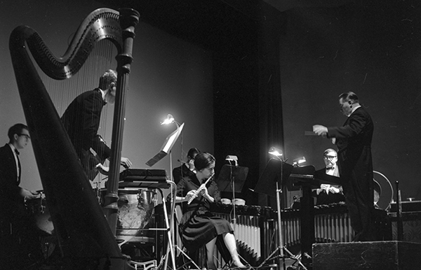 man conducting ensemble