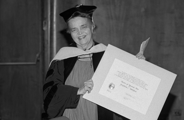 older woman with diploma