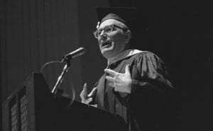 man speaking at graduation