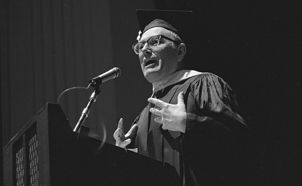 man speaking at graduation