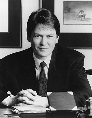 man in suit at desk