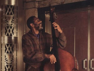 Ron Carter is pictured, playing acoustic bass, outside Borden Auditorium.