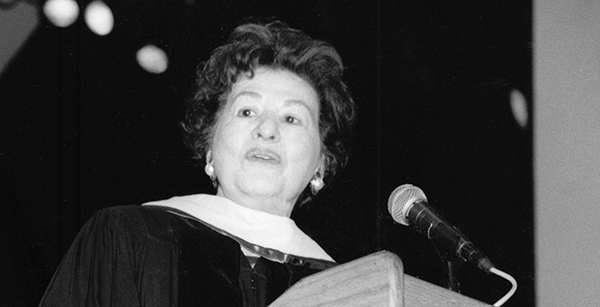 woman at graduation lectern