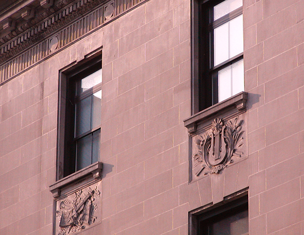 stone friezes on side of building