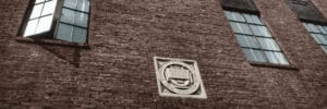 MSM stone seal on the side of a brick building at east 105th Street