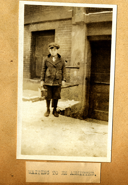 1920s photo of boy with violin case